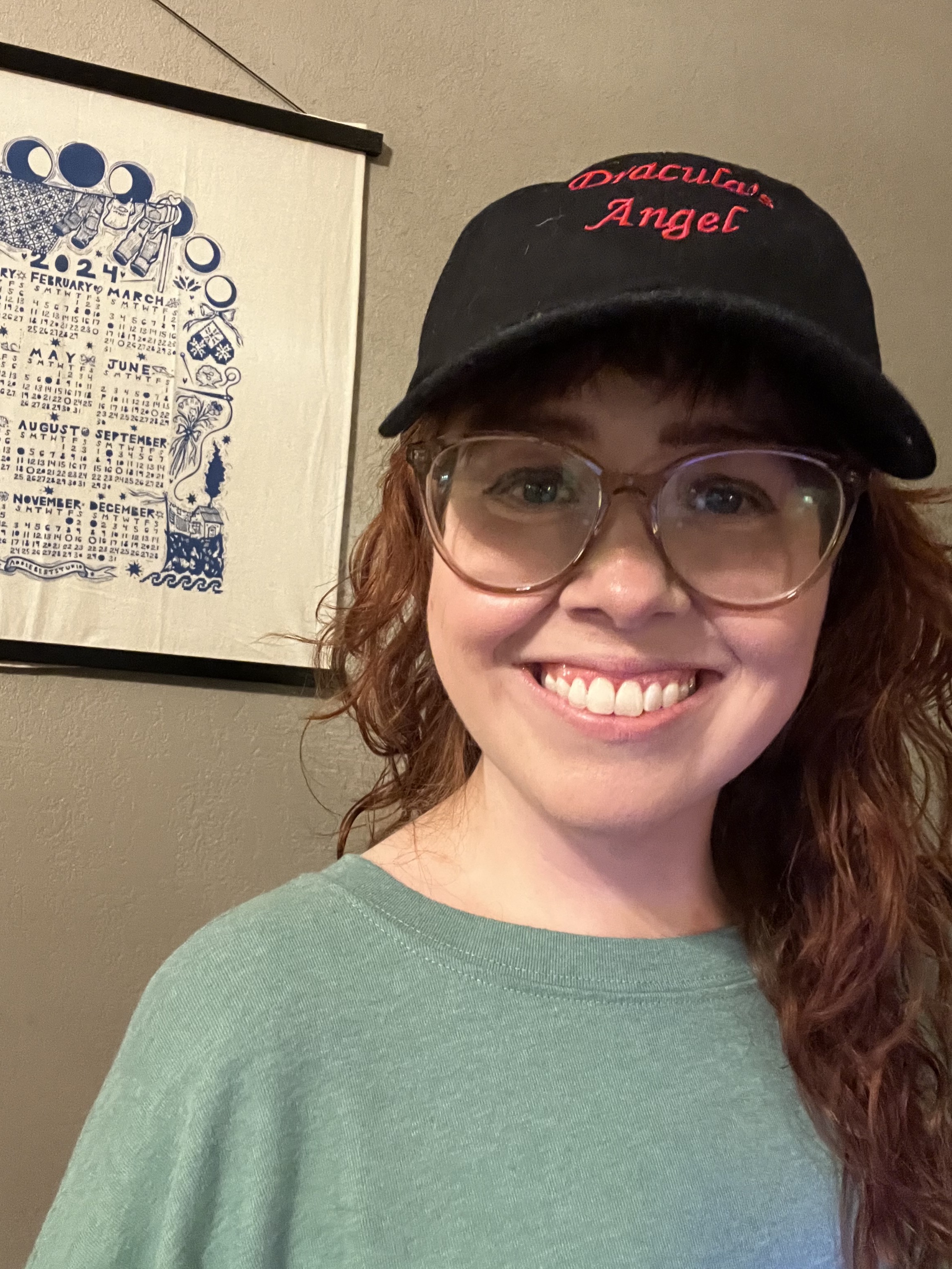 <Meghan models her hat.